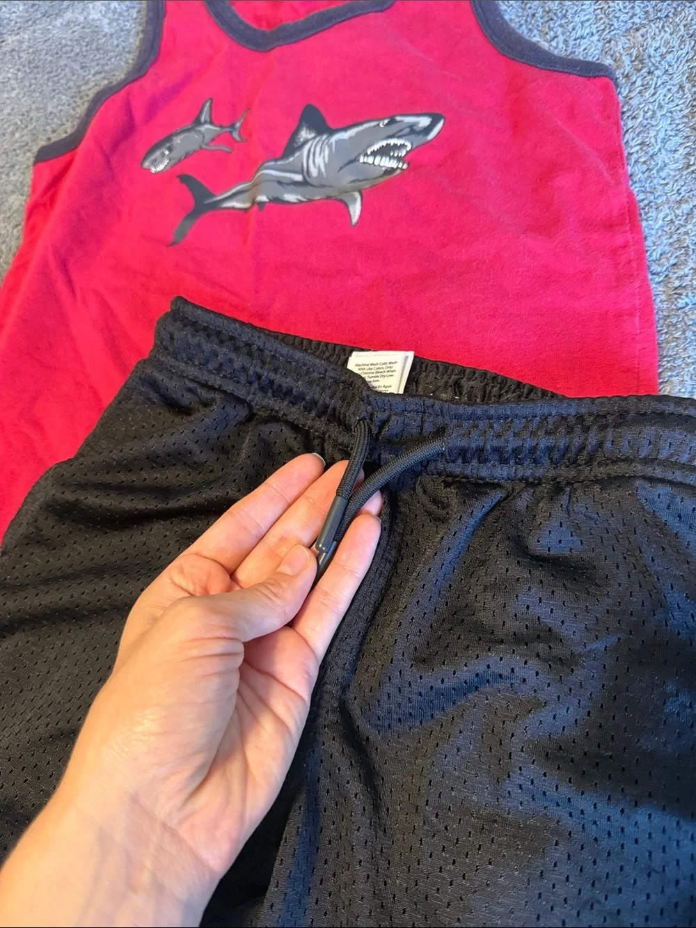 Red Shark Tank Top with Black Athletic Shorts